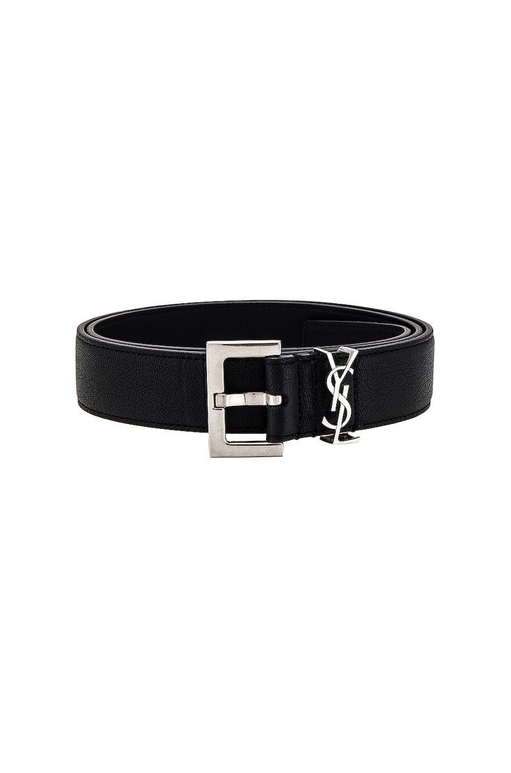 Find SAINT LAURENT Belt on Editorialist. Saint Laurent Belt in Black Grained genuine leather. Made in Italy. Measures approx 1H. Brushed silver-tone buckle closure. Interlocking logo hardware on front. SLAU-MA17. 634440 BRM0E. About the designer: SAINT LAURENT has been influencing and revolutionizing the fashion industry since the debut of its iconic ‘Rive Gauche’ collection in 1966 - the couture house was the first to create a ready-to-wear capsule. The sleek, precisely tailored staples, like t Saint Laurent Belts, Luxury Black Belt With Silver-tone Logo Plaque, Luxury Black Belt With Silver-tone Logo, Elegant Black Belt With Silver-tone Logo, Designer Black Belt With Buckle, Designer Black Belt With Buckle Closure, Designer Black Belts With Buckle Closure, Designer Silver Belt With Buckle Closure, Classic Leather Belt With Silver-tone Logo Plaque