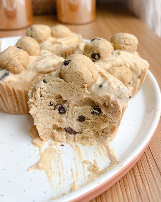 a muffin on a plate with chocolate chips