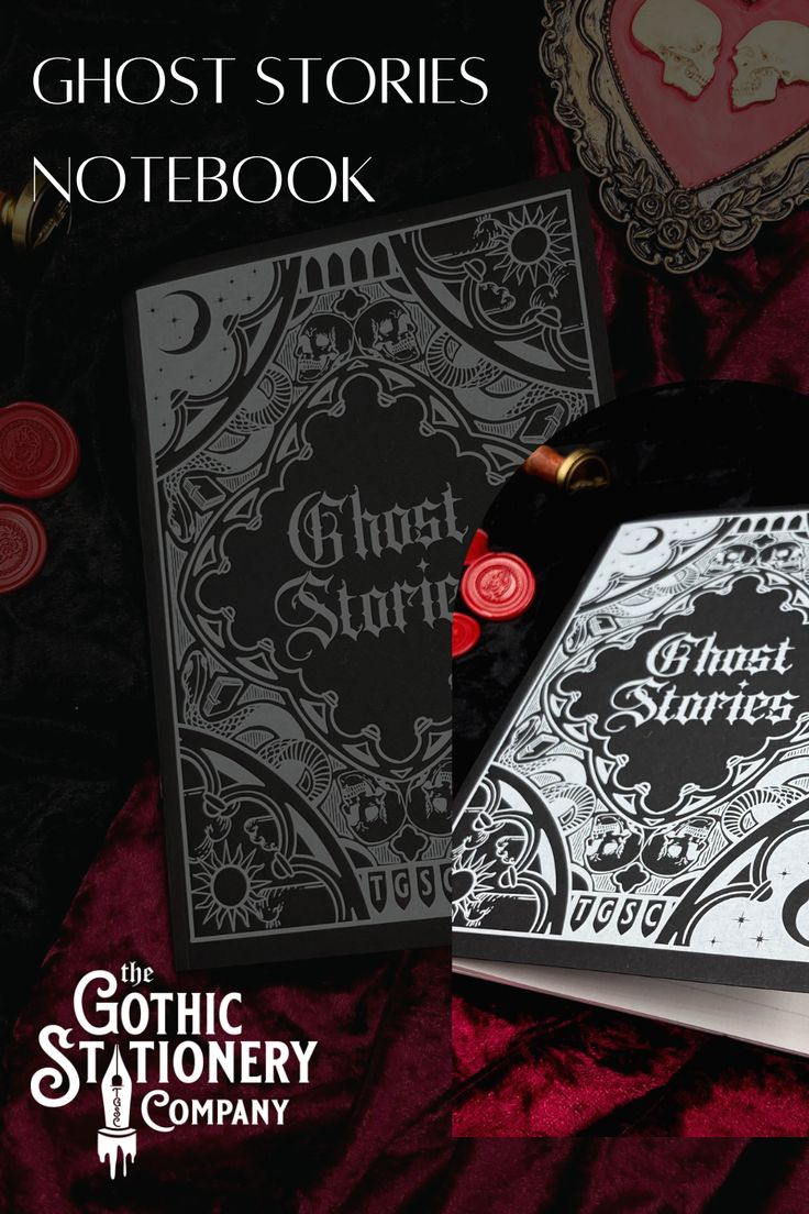 the ghost stories notebook is laying on a red velvet surface with other items surrounding it