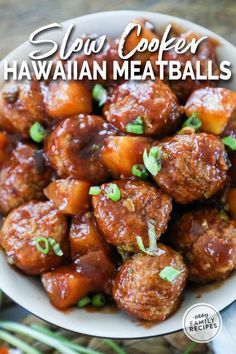 slow cooker hawaiian meatballs in a white bowl with green onions on the side