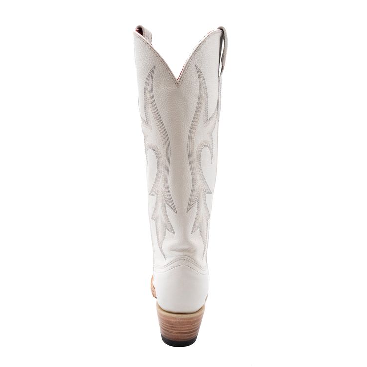 A classic silhouette of the true western dress boot for any occasion. Accented with an understated stitch, a fashion toe and heel to give a sense of elegance and class. Chic Leather Boots For Western-themed Events, Chic Leather Boots For Ranch, Chic Leather Ranch Boots, Chic Stacked Heel Boots For Rodeo, Chic Boots With Stacked Heel For Rodeo, Pointed Toe Heeled Boots With Reinforced Heel For Ranch, Stacked Heel Pointed Toe Boots For Western-themed Events, Fitted White Boots For Country Events, Western Style Formal Heeled Boots With Leather Sole