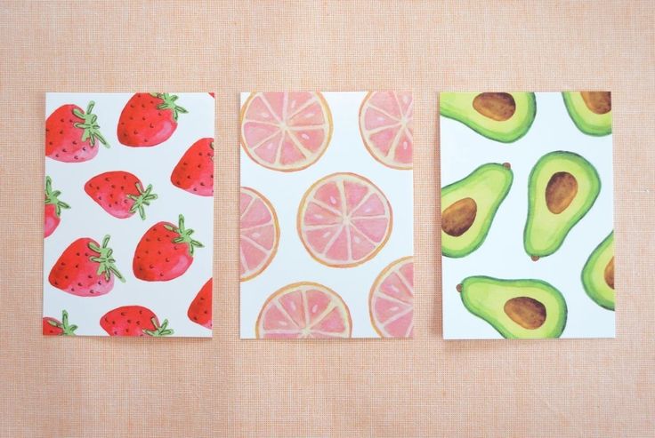 three cards with fruit and avocado on them