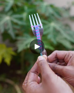 a person holding a plastic fork in their hand