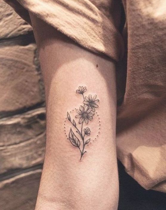 a small tattoo with flowers on the side of the arm and an inscription that reads simple arm tattoos 60 + most beautiful