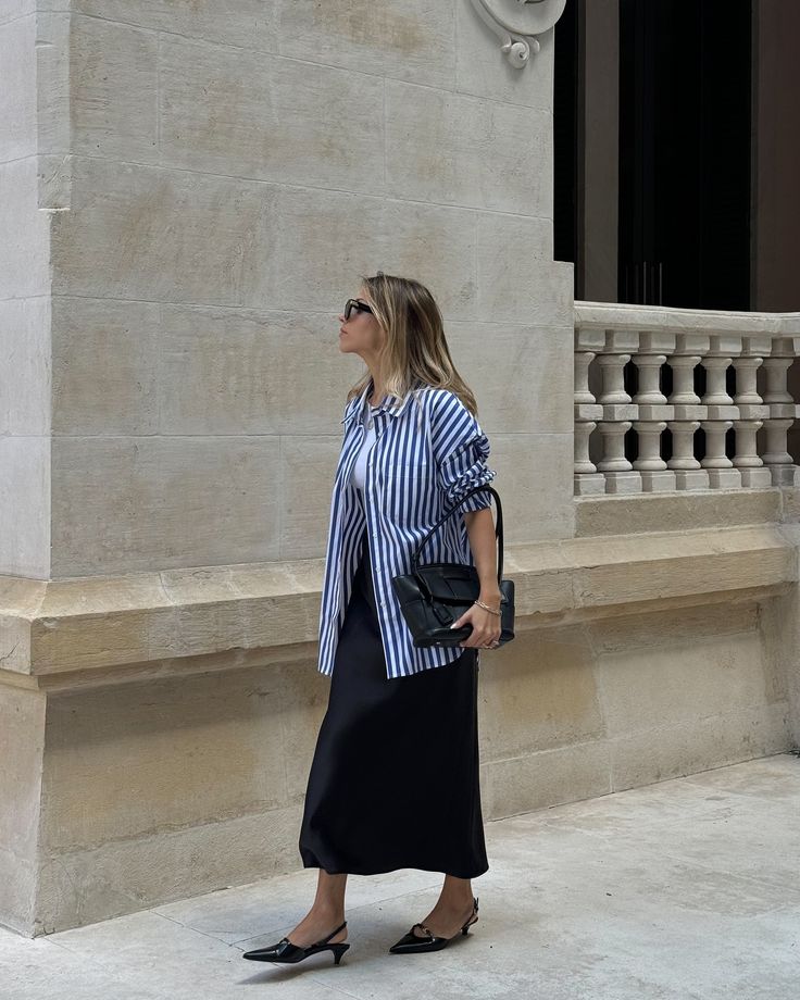 Styling a blue striped shirt for the office paired with a black silk skirt and massimo dutti slingbacks #springoutfit #outfitinspiration #stripedshirt #avenuethelabel #silkskirt #slingback #portuguesegirl #stylingideas Black Silk Skirt, Blue Striped Shirt, Office Outfit, Slingbacks, Silk Skirt, May 27, Office Outfits, Massimo Dutti, Black Silk