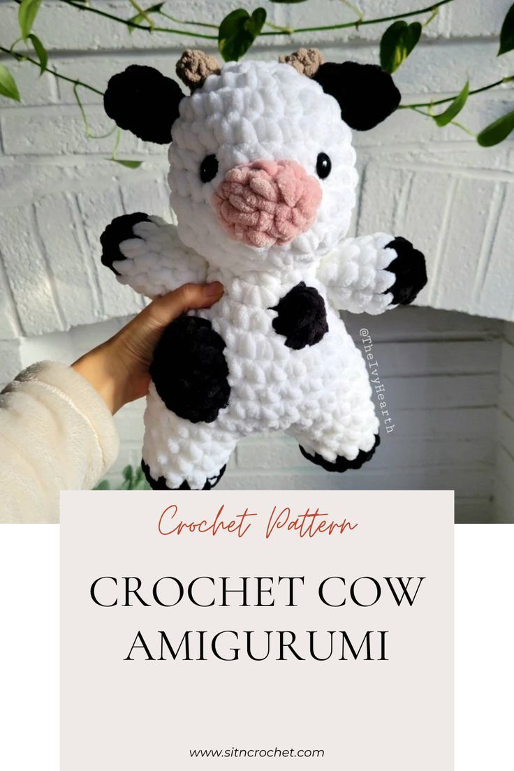 a crochet cow amigurum is shown in front of a white brick wall