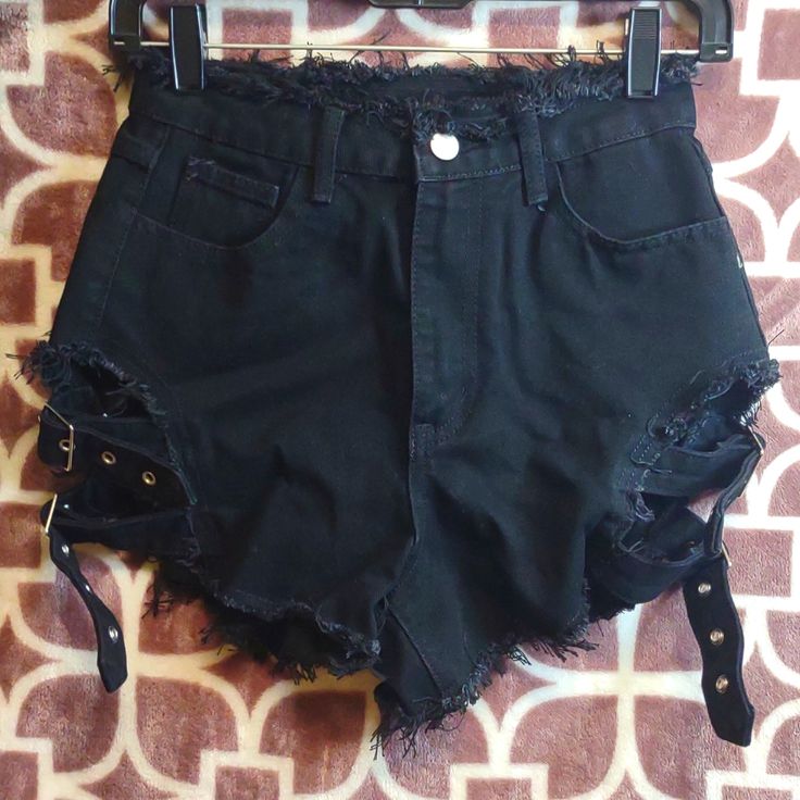 Nwot Women's Sexy/Punk Style High Waisted Black Jean Factory Distressed Cheeky Shorts. Frayed On Top And Frayed On Bottom Of Leg And Back Pockets 2 Adjustable Buckle Straps On Each Side Of Leg. Bought From (Shein) But Never Wore Them. Size: Xsmall Fits Like A Small Waist: 13" Flat Rise: 9" Flat Perfect Condition Comes From Smoking And Pet Free Home All Pre-Owned Items Are Dry-Cleaned Before Shipped Out Come Check Out My Other Listings In My Closet And Bundle And Save Alternative Style Club Bottoms With Belt Loops, Alternative Style Bottoms With Belt Loops For Club, Edgy Black Shorts With Belt Loops, Black Club Bottoms With Belt Loops, Black Bottoms With Belt Loops For Club, Punk High-waisted Halloween Bottoms, Black Grunge Bottoms For Concert, Gothic Bottoms With Belt Loops For Party, Fitted Grunge Bottoms For Club