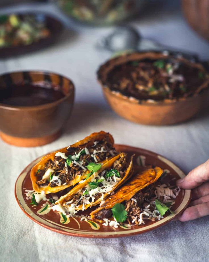 a plate with some tacos on top of it