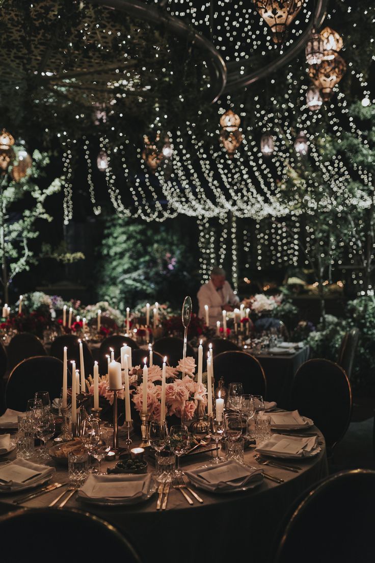 a table with candles and flowers on it