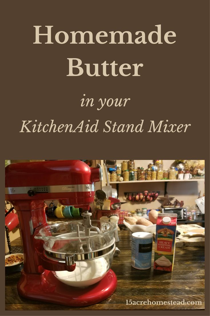 a red mixer sitting on top of a wooden counter