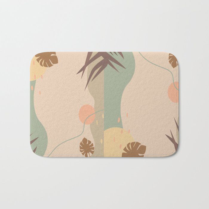 a bath mat with an abstract design on the front and back of it, featuring palm leaves