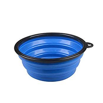 a blue bowl with black rims on the bottom and an inner ring around it