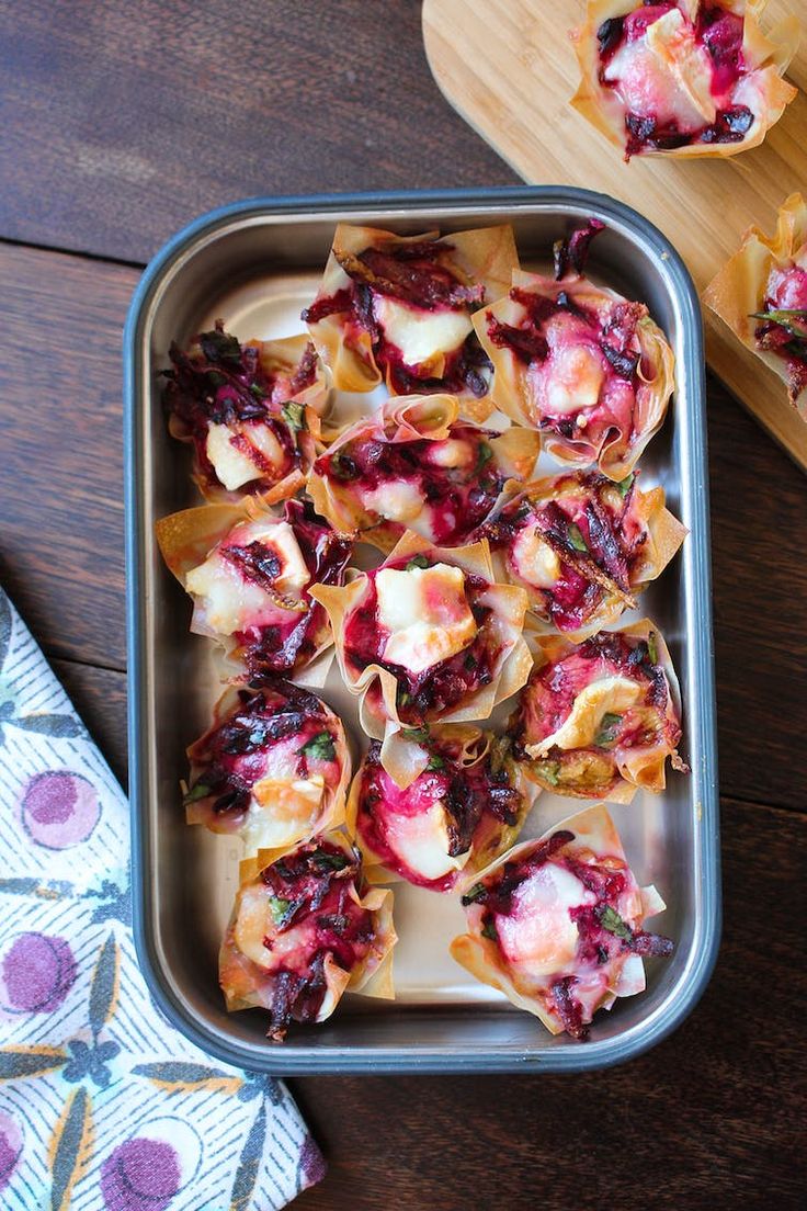 a pan filled with food on top of a wooden table