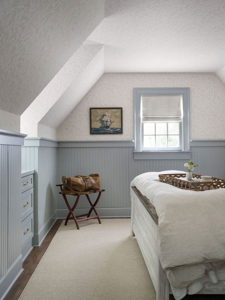 a bedroom with white walls and carpeted flooring