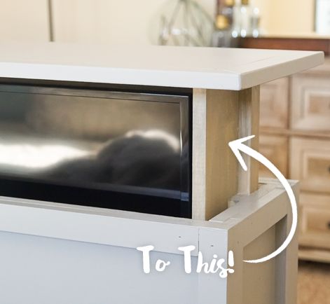 a microwave oven sitting on top of a white counter next to a dresser with drawers