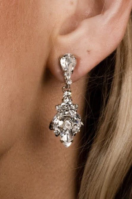 Introducing our IDIL Swarovski Drop Earrings! Inspired by tear drop shaped crystal that trickles down the ear to add a lasting touch to every look. These will look elegant with a casual look or a night out paired with your favorite dress and heels. They are meant to become your earrings of choice for high-style event. Love this earring but looking for something daintier? Check out our NAZ Earrings! Handcrafted Highest Quality Swarovski / Cubic Zirconia Platinum plated Guards against scratches an Swarovski Drop Earrings, Earring Inspired, Crystals Earrings, Boutique Couture, Swarovski Crystal Earrings, Earrings Wedding, Drop Earring, Silver Drop Earrings, Wedding Jewelry Sets