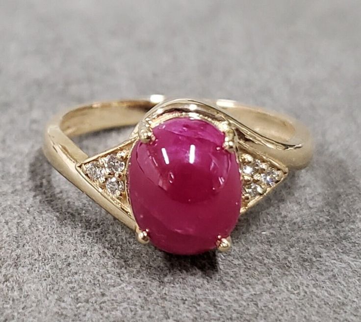 1. Ruby & Diamond 14k Gold Ring 2. Stamped 3. Gemstone - Ruby, Diamond  4. Jewelry Type - Gold Ring 5. Total Weight - 4.160 Gram Approx. 6. Diamond Weight - 0.05 Carats  7. Ruby Weight - 4.15 Carats 8. Gold Weight - 3.320 Grams Approx.  9. Ruby Size - 10 x 8 MM 10. Gold Purity - 14k  11. Band Size - 2.35 MM 12. Handmade Items 13. AAA Quality Ring 14. Stackable Ring 15. 1 Quantity Available 16. Ready to Dispatch in 1 - 2 days. 17. Express shipping inclusive  Pictures are taken under natural and d Fine Jewelry Ruby Oval Cabochon Ring, Fine Jewelry Ruby Cabochon Ring, Yellow Gold Ruby Gemstones With Accents, Red Diamond Oval Cabochon Ring, Fine Jewelry Ruby Ring With Oval Cabochon, Oval Cabochon Ruby Gemstones, Fine Jewelry Ruby Ring With Gemstone Accents, Fine Jewelry Ruby Gemstones With Accents, Cabochon Ruby Ring For Anniversary