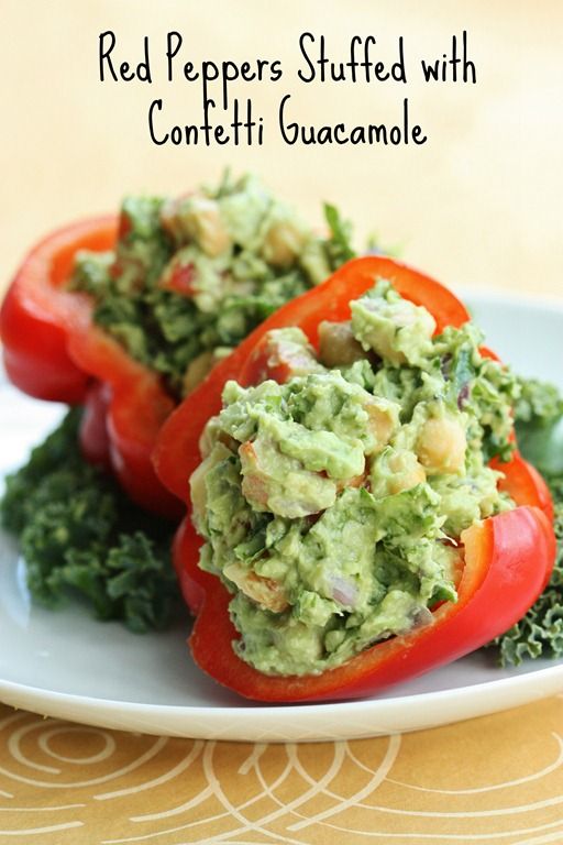 red peppers stuffed with confetti guacamole on a plate