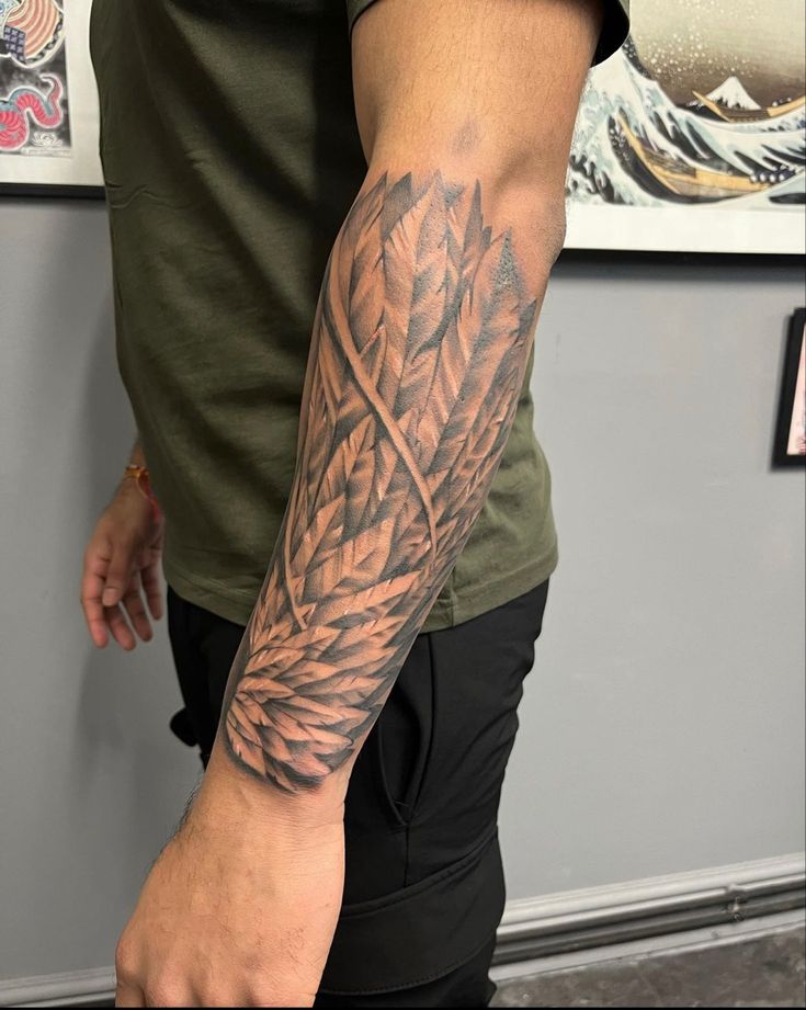 a man with a tattoo on his arm