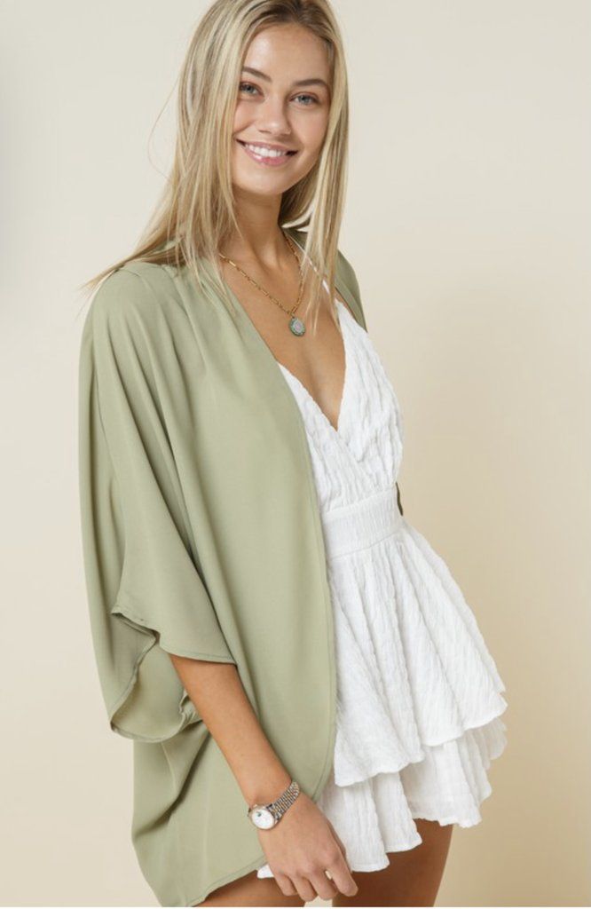 Chance Encounter Light Olive Kimono Spring Flowy Wrap Cover-up, Chic Spring Layering Cover-up, Chic Wrap Cover-up For Spring, Summer V-neck Shrug, Chic V-neck Shrug For Spring, Chic V-neck Shrug For Summer, Chic Long Sleeve Summer Shrug, Chic V-neck Summer Shrug, Chic Open Front Beach Cover-up Top