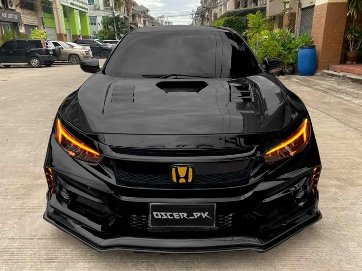 the front end of a black sports car