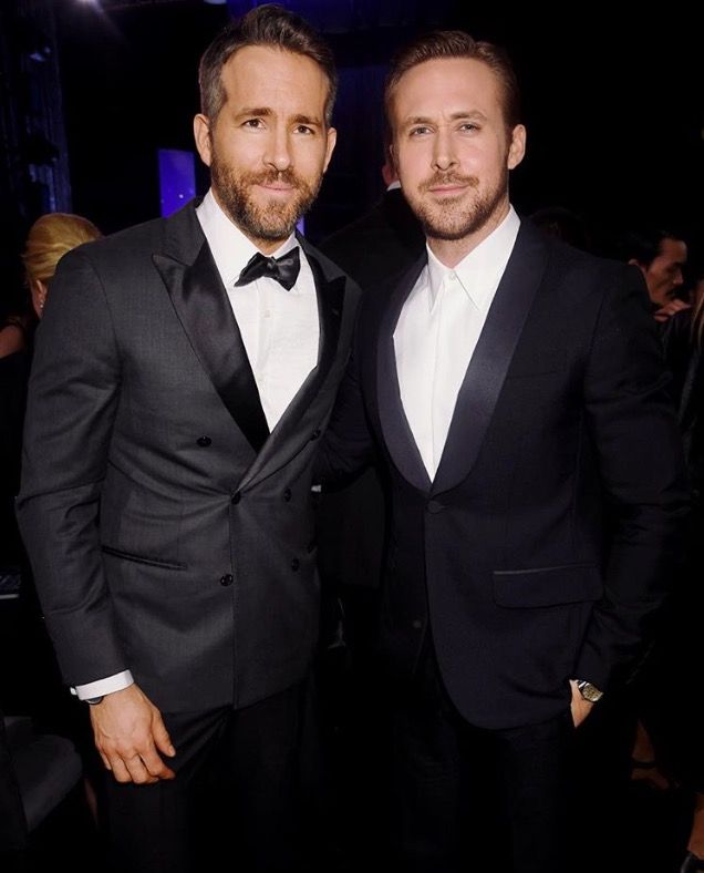 two men in tuxedos standing next to each other at a formal event together