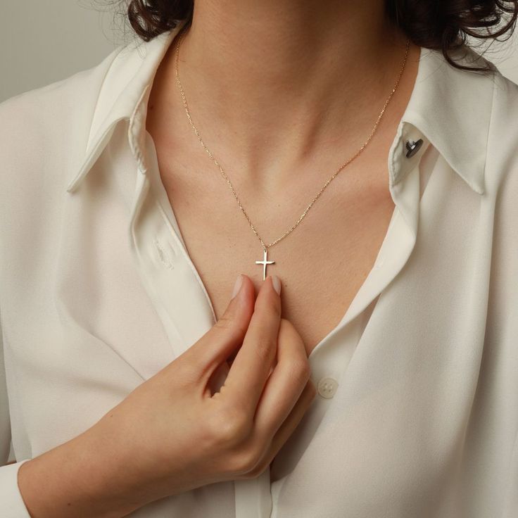 Showcase your faith with our Cross Pendant Necklace. The perfect gift for confirmation, christening, or any special occasion. Made for women who want to make a statement of their belief in a stylish and elegant way. Get one for yourself or a loved one today! Pendant width: 10 Millimeters; Pendant height: 16 Millimeters Please note that we also offer matching Cross Bracelet in our shop! Elegant Clavicle Chain Cross Necklace For Gift, Elegant Crucifix Cross Necklace, Minimalist Rose Gold Cross Pendant Jewelry, Minimalist Rose Gold Cross Pendant, Elegant Rose Gold Sterling Silver Cross Necklace, Elegant Cross Necklace With Delicate Chain For Gift, Elegant Pendant Cross Necklace As Gift, Elegant Pendant Cross Necklace For Gift, Elegant Crucifix Jewelry With Delicate Chain