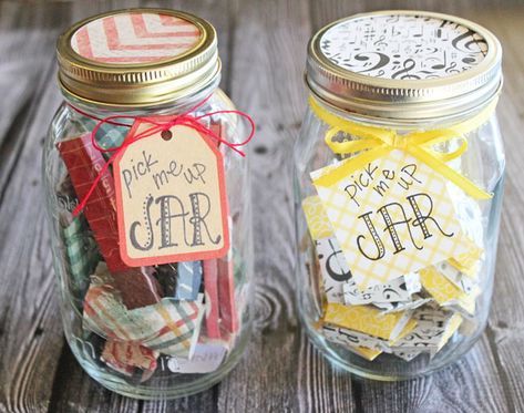 two mason jars filled with different types of gift tags