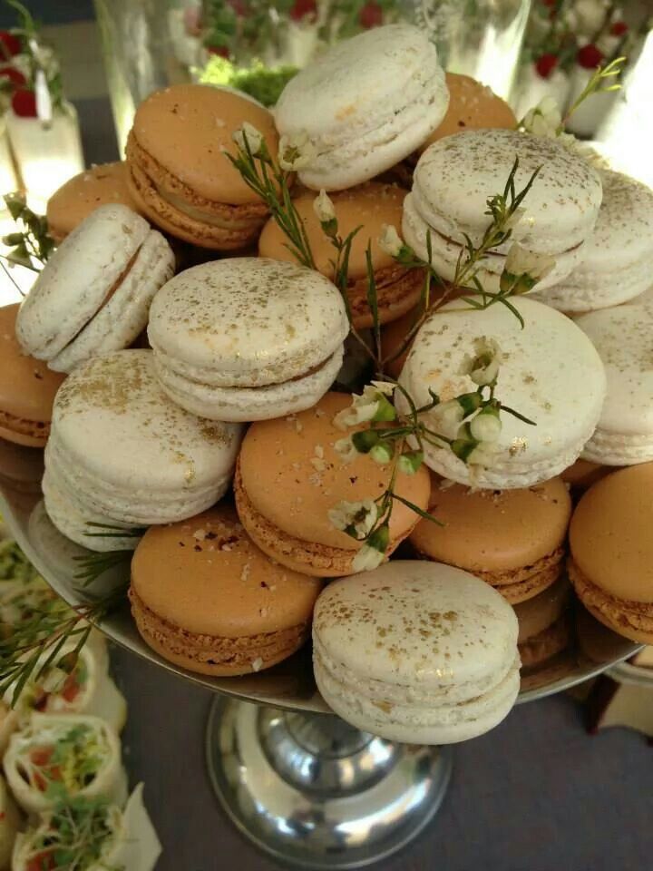 a platter filled with lots of different types of macaroons