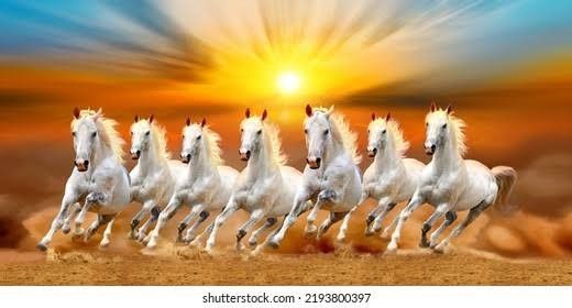 a group of white horses galloping in the desert at sunset or sunrise with clouds and sunburst