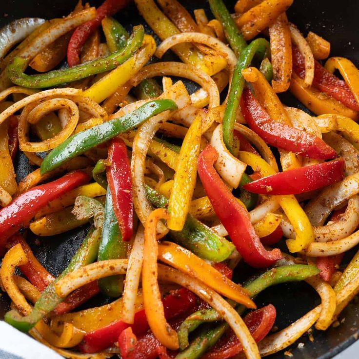 stir fry with peppers and onions in a wok