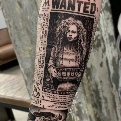 a man's arm with an old wanted poster on it