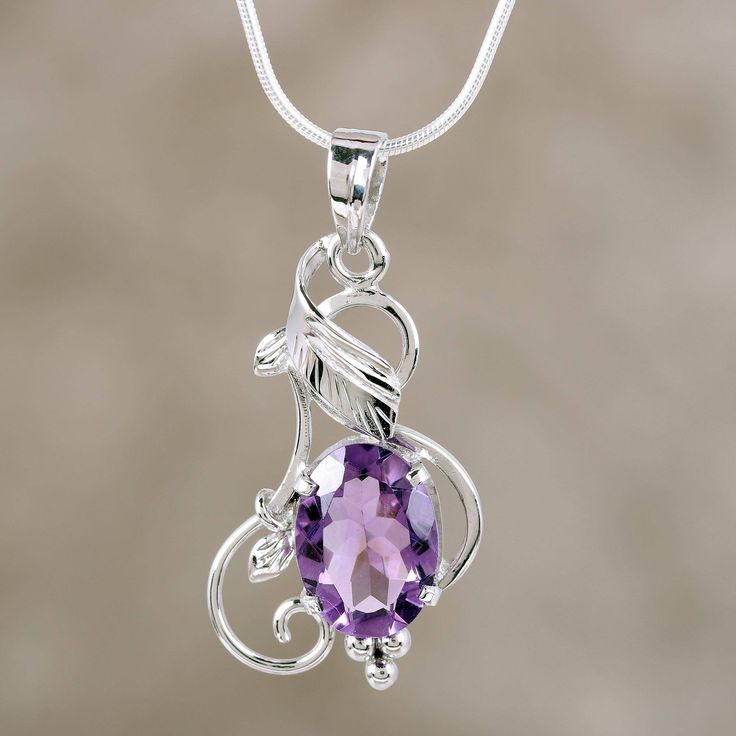 Evoking summer's glory this beautiful necklace comes from Parul in India. Sterling silver tendrils caress a faceted oval of amethyst which totals 5 carats. A sleek chain completes the design. .925 Sterling silver Amythest Necklace Jewelry, Elegant Oval Amethyst Pendant Jewelry, Elegant Purple Oval Pendant Necklace, Elegant Purple Jewelry With Large Pendant, Elegant Amethyst Round Pendant Jewelry, Purple Amethyst Oval Pendant Jewelry, Fine Jewelry Amethyst Oval Pendant, Purple Oval Pendant Necklace For Anniversary, Faceted Oval Sterling Silver Necklaces