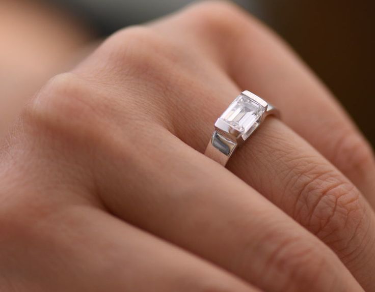 Emerald Cut Diamond Solitaire Engagement Ring with Open Channel Setting - Christopher Duquet Fine Jewelry Masculine Engagement Rings, Wide Engagement Ring, Silver Solitaire Engagement Ring, Man Rings, Gold Ring Design, Emerald Cut Diamond Engagement Ring, Emerald Cut Diamond Engagement, Future Engagement Rings, Channel Setting