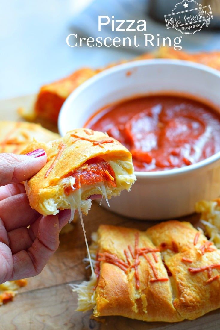 Easy and delicious Pizza Ring that is a snap to make. The perfect appetizer for parties, game day or family dinner. Only 3 ingredients! www.kidfriendlythingstodo.com #pizza #ring #crescent #appetizer #dinner #family #meal #easy Recipe With Biscuits, Stuffed Pastry, Crescent Rings, Entertaining Meals, Pillsbury Crescent Roll Recipes, Crescent Roll Recipes Dinner, Pizza Ring, Crescent Roll Pizza, Appetizer Dinner