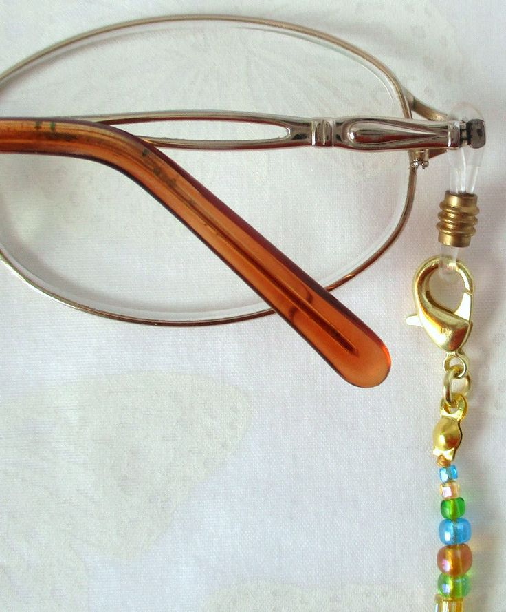 Never leave your reading glasses behind - use this yellow/multicolor beaded eyeglass chain! 24.5" in length, made with glass beads, beading cord, metal lobster clasps, and adjustable rubber holders. Lobster clasps make it easy to change the rubber holders, and an extra pair of holders included with every purchase. This bright yellow/multicolor beaded eyeglass chain will arrive in a gift box, ready to give as a present or to keep and store. Back to Beaded Eyeglass Chains Adjustable Czech Glass Beaded Necklaces With Lobster Clasp, Adjustable Beaded Chain Necklace For Everyday, Metal Beaded Necklace With Adjustable Chain, Adjustable Colorful Beaded Jewelry For Everyday Use, Adjustable Gold Beaded Necklaces Nickel Free, Adjustable Metal Beaded Necklaces Nickel Free, Adjustable Gold Beaded Necklace Nickel Free, Adjustable Gold Nickel-free Beaded Necklace, Adjustable Metal Beaded Necklace Nickel Free