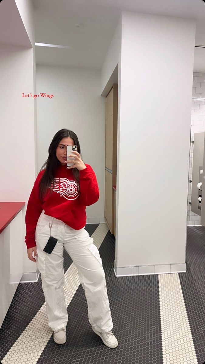 red wings hoodie white cargo pants from H&M hockey game outfit, red wings outfit, sports outfit, sporting event outfit, white cargo pants, jersey outfit, hockey girlfriend style, hockey wife, casual sporty outfit, basketball game outfit, NHL outfit, NBA outfit, Red Wings Game Outfit, Nhl Outfit Ideas Woman, Nhl Wife Outfit, Hockey Wife Outfit, Hockey Date Outfit, Hockey Game Fits, Nhl Game Outfit Woman, Nhl Outfit, Red Wings Outfit