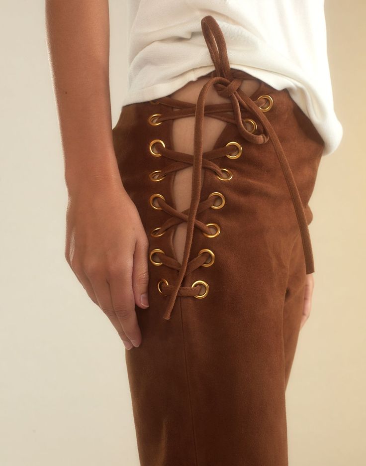 Straight leg lace-up pants in brown suede Premium suede Straight-leg silhouette High rise Adjustable lace-up sides with gold eyelets Rich caramel brown Fabric content: 100% leather Care instructions: dry clean only Fit: model is 5'10" and wears a size 4. Size 4 measurements: Length: 44" Complete the look: Mica Sleeveless Knit Top Chic Brown Suede Bottoms, Color Leather Pants, Brown Leather Pants, Suede Top, Sleeveless Knit Top, Suede Pants, Knit Alpaca, Sleeveless Knit, Favorite Daughter