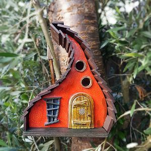 a bird house in the middle of some trees