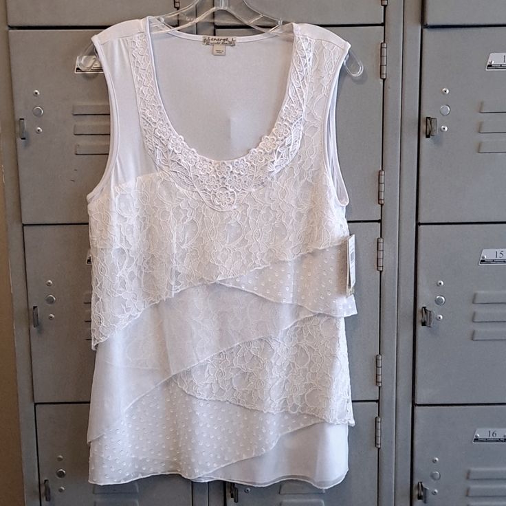 Cute Stretchy Sleeveless Top With Layers Of Lace On The Front. Size Large. New With Tags. Spring Sleeveless Camisole, Sleeveless Camisole For Spring Layering, Spring Sleeveless Camisole For Layering, Spring Layering Sleeveless Tank Top, Spring Sleeveless Layering Camisole, White Sleeveless Camisole For Layering, Sleeveless Pullover, Sleeveless Top, Color White