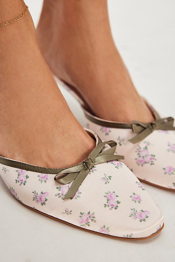 You’re the most darling in this dainty pair of heels from For Love & Lemons, featured in a mule style with a floral-printed upper and sweet bow details. **Features:** Slip-on style, backless design, floral-printed satin uppers, round toe, bow detail, kitten heel **Why We | For Love & Lemons Chateau Mule Heels at Free People in White, Size: EU 38 Feminine Kitten Heels With Block Heel For Spring, Chic Open Heel Floral Print Heels, Feminine Spring Kitten Heels With Block Heel, Feminine Pink Mules For Spring, Spring Feminine Kitten Heels With Block Heel, Chic Floral Print Open Heel Heels, Feminine Summer Kitten Heels With Almond Toe, Feminine Spring Kitten Heels With Low Heel, Feminine Party Mules For Spring