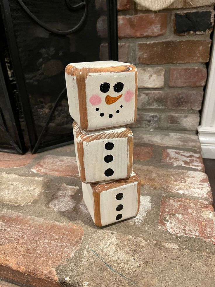 three blocks made to look like a snowman