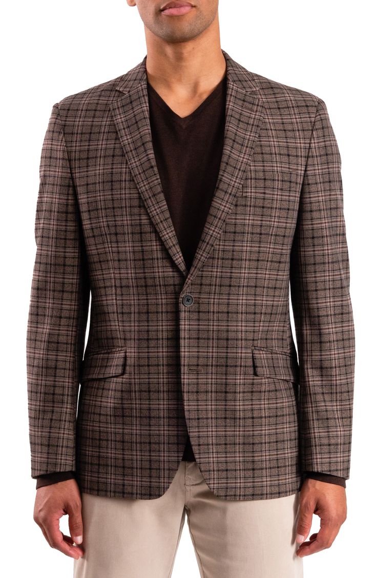 A rich plaid distinguishes this modern sport coat that'll add a dapper finishing touch to your look. Two-button closure Notched lapels Chest welt pocket; front flap welt pockets Lined 59% polyester, 37% rayon, 4% spandex Dry clean Imported Tailored Plaid Sport Coat For Business Casual, Plaid Sport Coat With Hidden Button For Business Casual, Fitted Plaid Blazer With Welt Pockets, Plaid Notch Lapel Sport Coat For Business Casual, Fitted Plaid Sport Coat For Business, Plaid Fitted Sport Coat For Business, Fitted Plaid Sport Coat For Semi-formal Occasions, Semi-formal Fitted Plaid Sport Coat, Plaid Sport Coat With Notch Lapel And Single Button