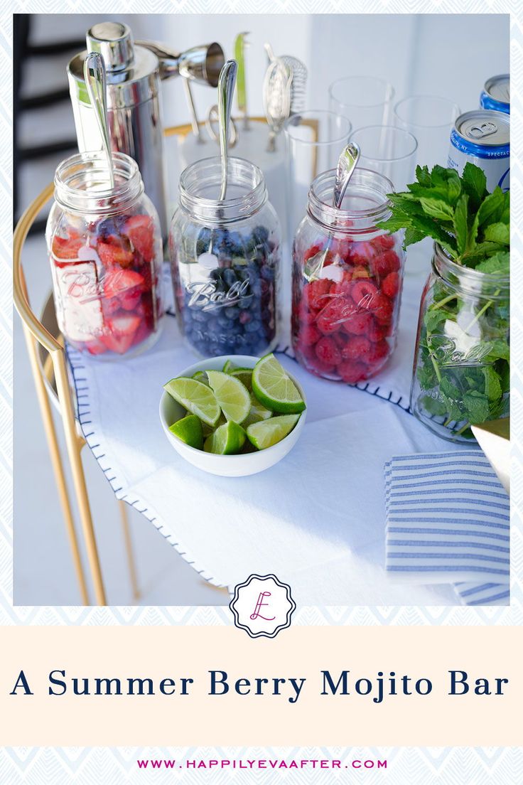 a table topped with mason jars filled with fruit and veggies