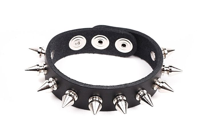 "Single Row 1/2\" Spiked wristband. This is a finely made Vegan Friendly wristband. It is made out of a heavy duty Vegan Friendly Material. available in Black. This is a one-size fits all band. It will fit most wrists ( 5\" up to 8\" ). 3/4\" wide band with snaps for adjustable fastening/closure. The 1/2\" Tall Spikes are a screwback design. These spikes are Solid Brass with a nice nickel plating ( making them look like Chrome/Silver )." Hipster Jewelry, Black Lace Choker Necklace, Spiked Jewelry, Punk Rock Jewelry, Spike Bracelet, Glamorous Jewelry, Vegan Jewelry, Rock Necklace, Leather Bangle