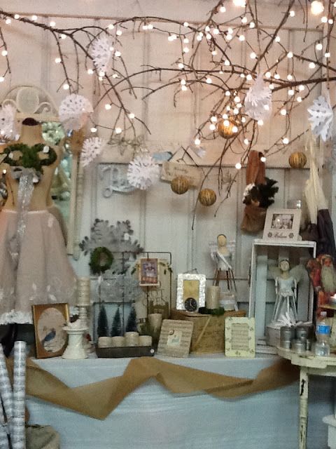 an image of a store window display with lights and decorations on the windowsills