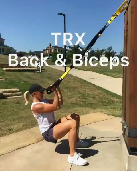 a woman squatting on the ground with a baseball bat in her hand and text that reads trx back & biceps