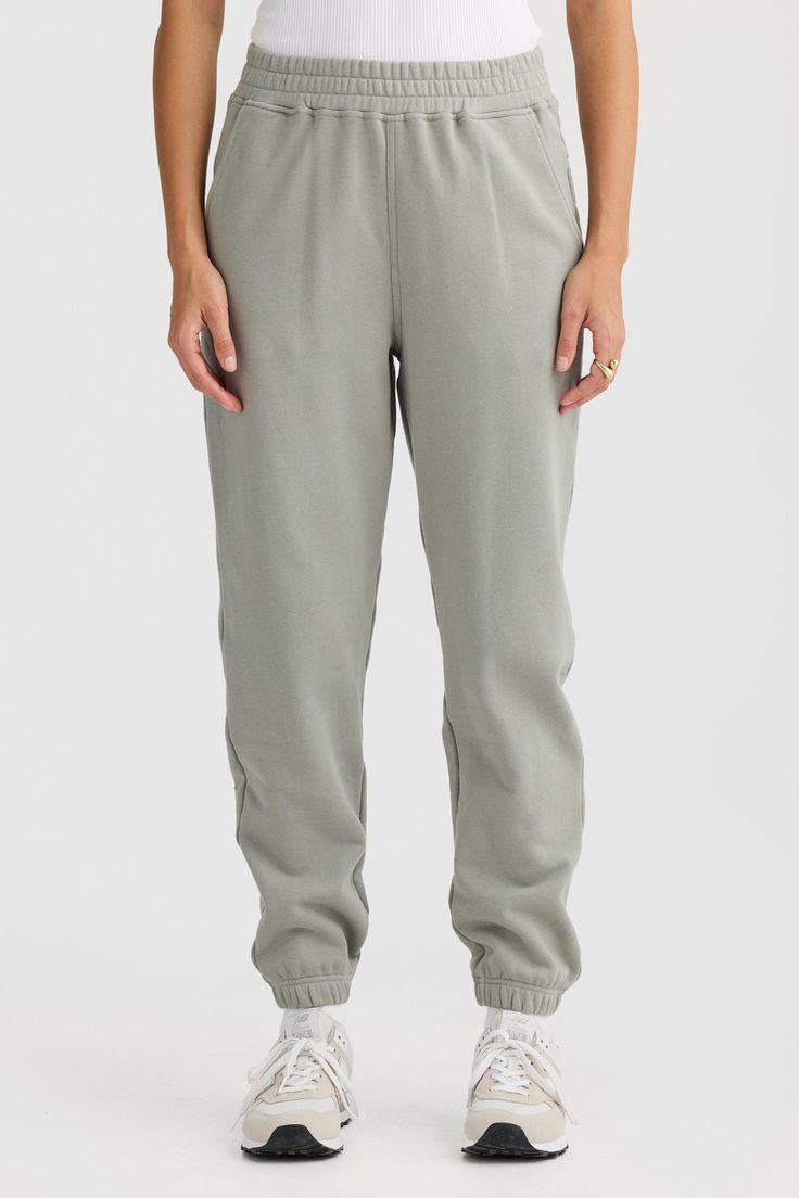 Comfort meets style with the Lena Track Pant Dusty Olive. Crafted from 100% mid weight Terry Cotton, these track pants are a must have addition to your athleisure collection. 100% Cotton French Terry Classic track pant with elasticated waist and design seam detailing Embroidered classic logo Elasticated cuffs Cutaway pockets Sporty Pants With Elastic Cuffs And Relaxed Fit, Joggers With Elastic Side Panels In Solid Color, Trendy Relaxed Fit Joggers With Ribbed Waistband, Athleisure Sweatpants With Ribbed Waistband, Sporty Joggers With Elastic Waistband, Sporty Joggers With Elastic Side Panels For Leisure, Sporty Bottoms With Elastic Cuffs And Straight Hem, Relaxed Tapered Leg Sweatpants In Solid Color, Relaxed Fit Pull-on Tapered Leg Sweatpants