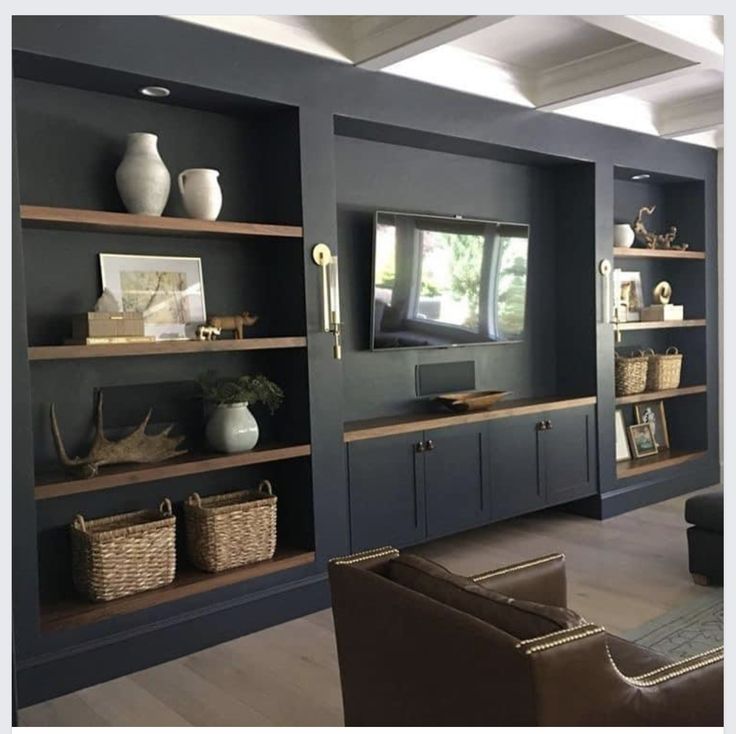 a living room filled with furniture and shelves