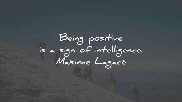 a group of people walking up a hill with the words being positive is a sign of intelligence